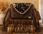 Bella Vita hand-tooled leather fringe shoulder bag in dark chocolate brown with speckled cowhide flap, long leather fringe, and gold longhorn emblem